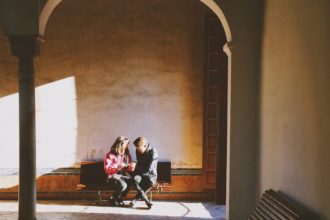 Two colleagues reviewing documents together