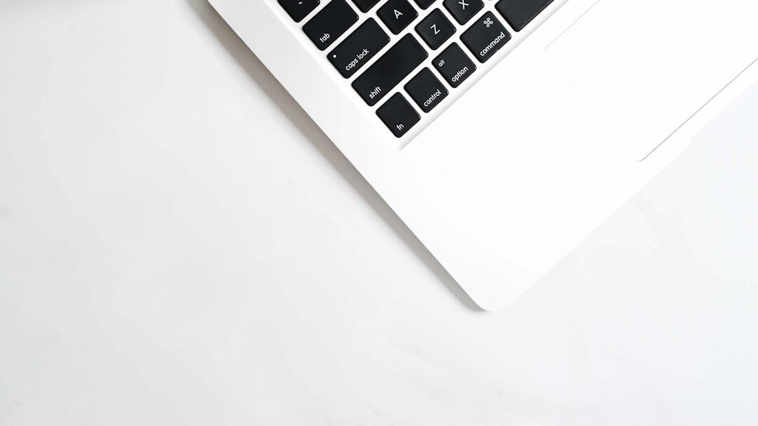 Overhead view of notebook, laptop and coffee on a desk